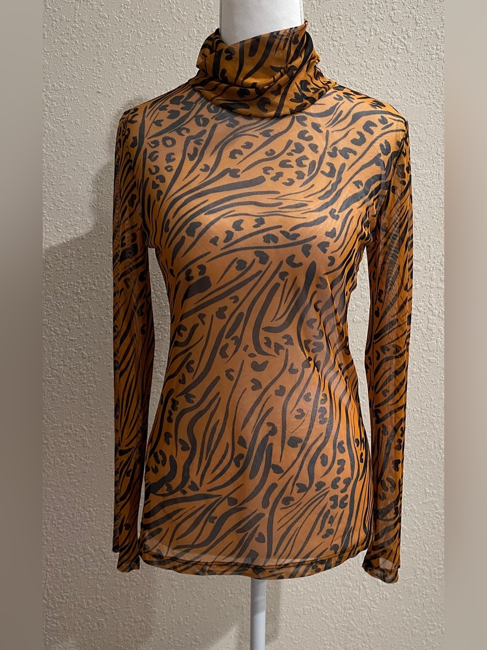 BCBGeneration Burnt Orange and Black Animal Print Sheer Long Sleeve Turtleneck
